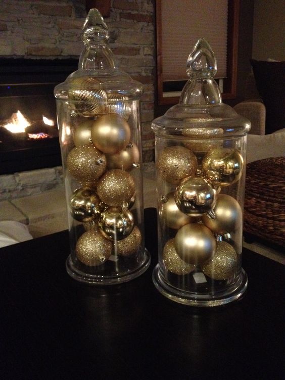 display some gold and gold glitter ornaments in jars to get chic Christmas decor