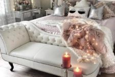 16 a creamy leather bench and a dusty pink faux fur blanket, a mirrored vanity and sequin pillows