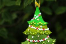 16 a felt Christmas tree ornament in different shades of green and with sequins can be DIYed
