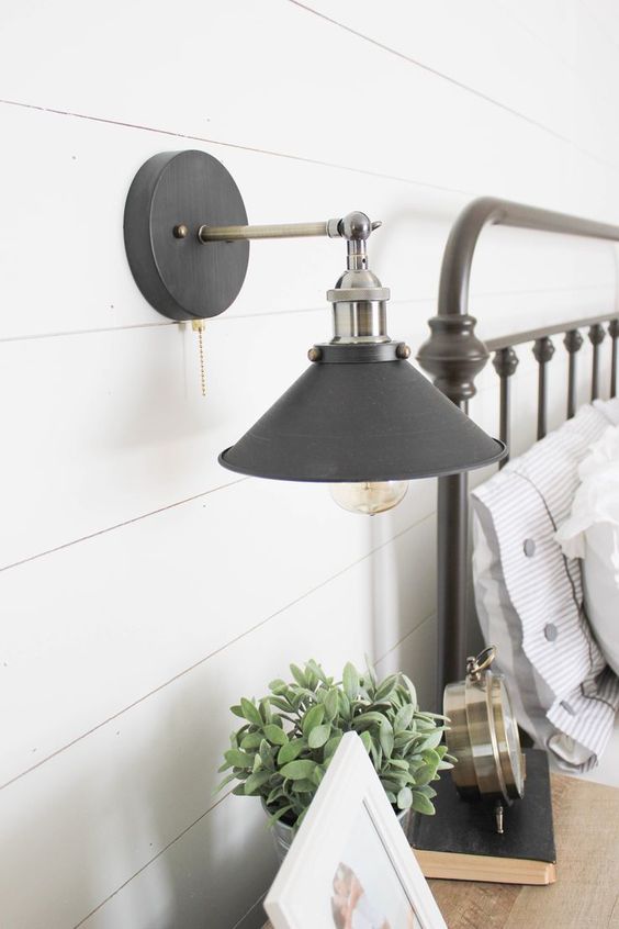 industrial sconce lighting in stainless steel and matte black for a farmhouse space