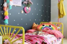 18 a bold and colorful girl’s room with a single black wall to look calmer