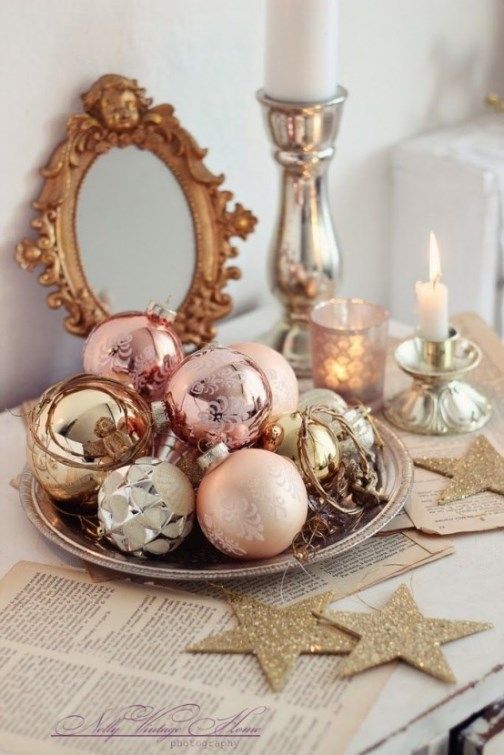 a tray with gold, copper, silver and pastel pink ornaments is a great holiday display