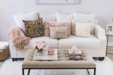 18 faux fur in grey and blush and a leopard pillow add glam to this living room