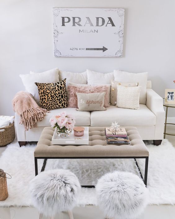 faux fur in grey and blush and a leopard pillow add glam to this living room