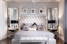 18 large mirrors on the wall and shiny textiles make the bedroom glam-like