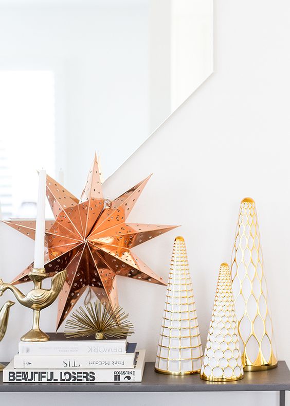 Gold and copper Christmas decor   Christmas trees and a large star