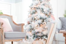 20 a flocked Christmas tree with copped ornaments and lights looks very chic and glam