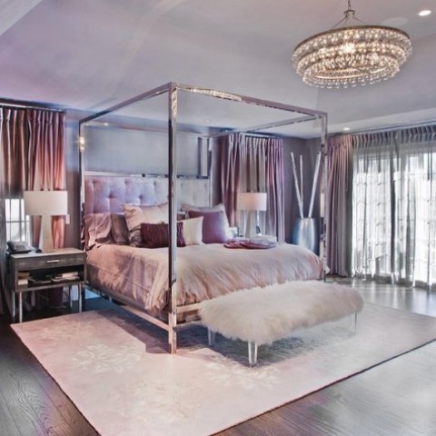 canopy beds are characteristic for glam spaces as they make a chic statement, and crystal chandeliers are nice, too
