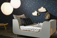 21 a dreamy bedroom with a black starry wall and matching sky-inspired bedding