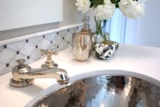 23 a shiny silver sink and matching faucets are great for a glam bathroom