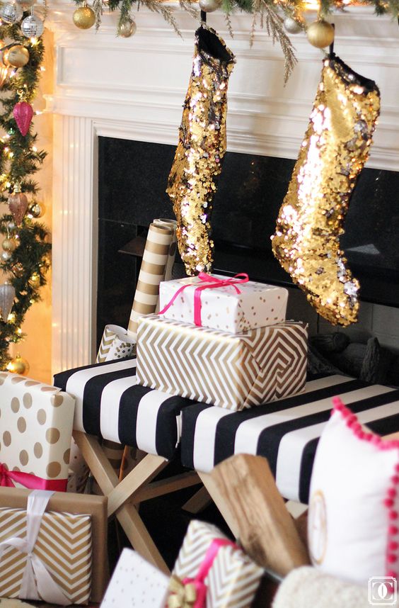 gold glitter stockings will add a fun and glam touch to the mantel