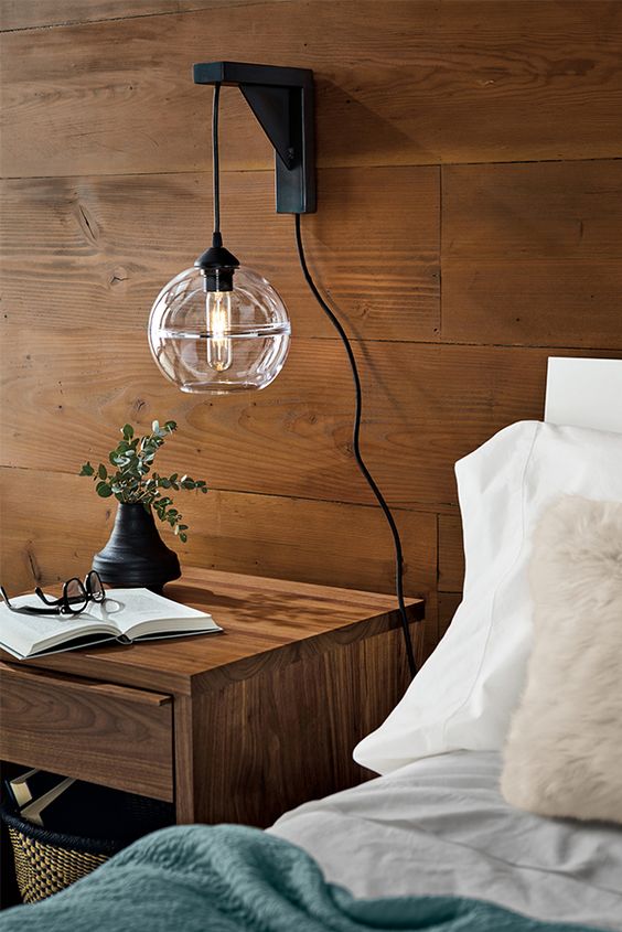 a gorgeous sconce and pendant lamp in one, a metal base and a glass shade