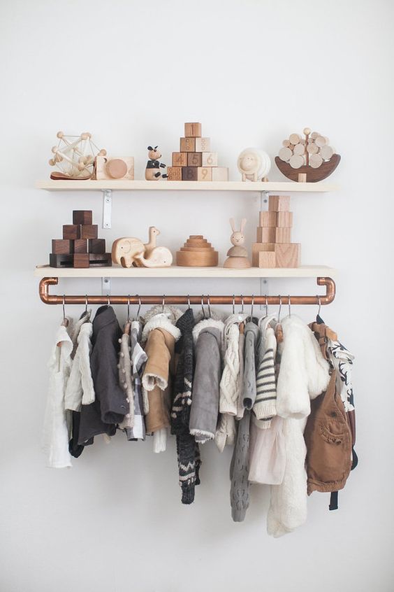 Open shelves with copper railing is a chic modern idea for any nursery