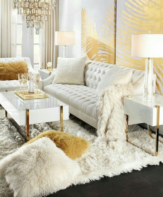 a luxurious glam living room done in cream and gold looks really wow