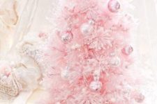 25 a pink Christmas tree with pearly and pink ornaments looks very sweet and glam