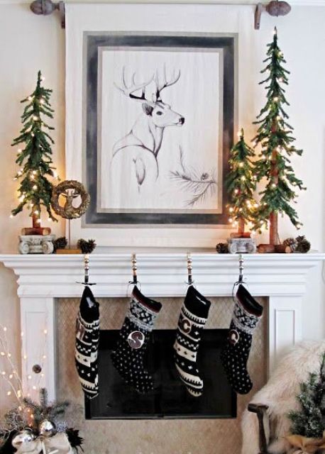 cute printed stockings in black and white, Christmas trees made of fir branches and lights for a woodland feel