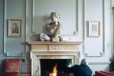 25 gorgeous mint-colored paneled walls and a fireplace clad with marble