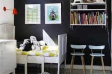 28 refresh a black statement wall with artworks and books to make it cooler