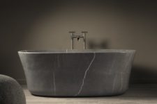 01 Calma bathtub is made of monolithic stone blocks and is available in two colors to fit your space