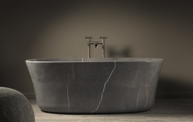 Calma bathtub is made of monolithic stone blocks and is available in two colors to fit your space