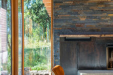 02 Wood, stone, blackened metal and leather are widely used throughout the house and create that cabin feel