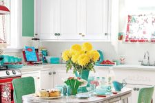 02 a bold green accent wall, matching chairs, a red cooker and turquoise touches ehre and there
