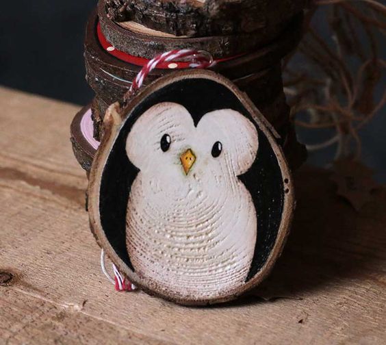 a cute wood slice penguin ornament is a great idea and is easy to paint yourself
