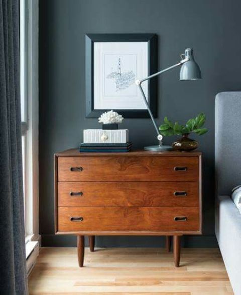 A mid century moden dresser to use as a nightstand and match the interior