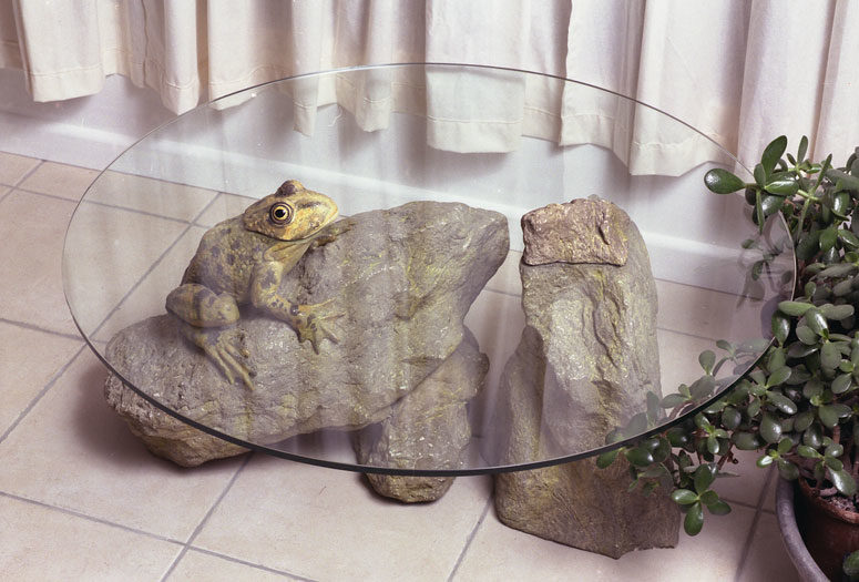 The Frog Table shows a frog sitting on a stone, looks very natural