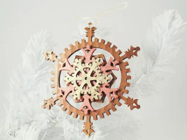 a colorful felt gear snowflake ornament for Christmas