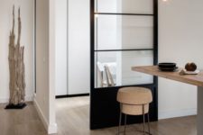 03 light-colored wood, cork, metal and a black glass sliding door