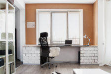 04 The working space is done with an orange wall, brick pillars, and it’s filled with natural light