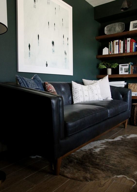 a black leather sofa is classics that will fit many interiors