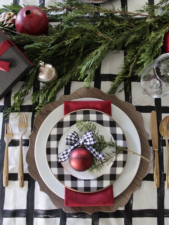 a plaid plate and a wooden charger can make up a cool setup for Christmas