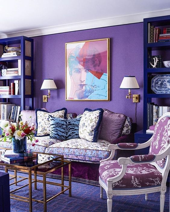 a violet statement wall and a geometric print rug in a refined space