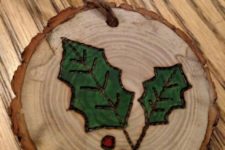 04 wood burnt and painted mistletoe wood slice ornaments with a strong rustic feel