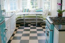 05 a turquoise fridge, hood and cooker and a diner-inspired eating zone make the space retro