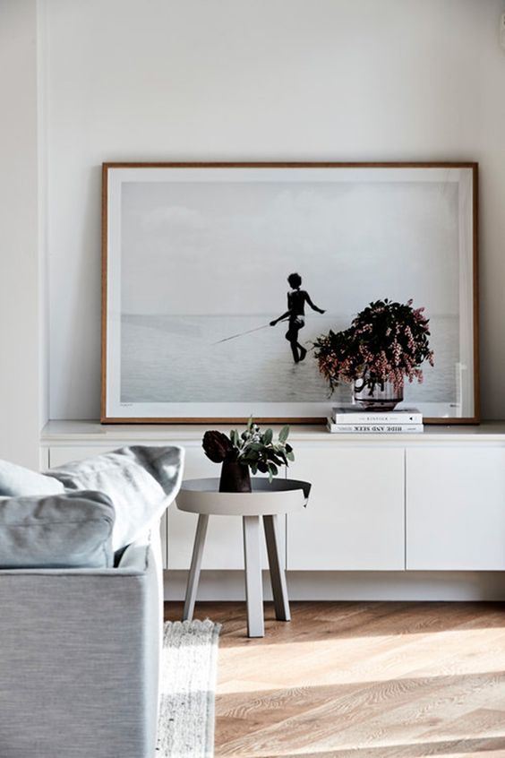 this artpiece is placed on the ikea-like sideboard and it is slightly shorter, so it looks harmonious
