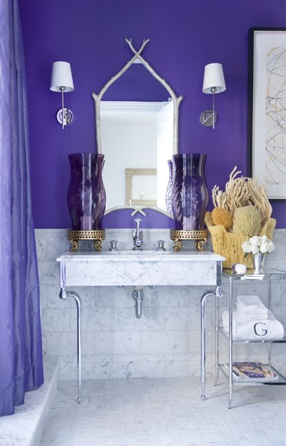 an ultra violet statement wall and matching curtains for a unique ocean-inspired bathroom