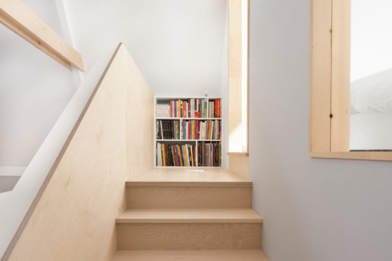 The end of the stairs is a bookcase, the designers got maximum of the space