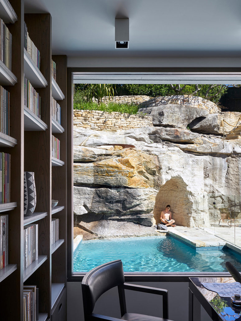 The study has the views of a small pool and a cave made in the rock for meditation