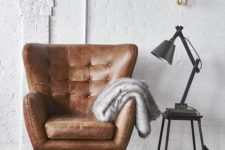 07 a comfy brown leather armchair plus metal items  for an industrial interior