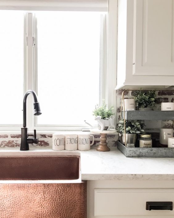 a hammered copper sink will bring a refined vintage feel to your kitchen