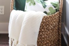 07 a large basket with blankets and pillows is ideal for a bedroom
