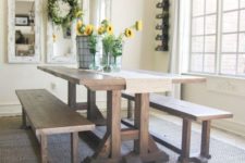 07 a simple rustic dining space with a trestle dining table and matching benches