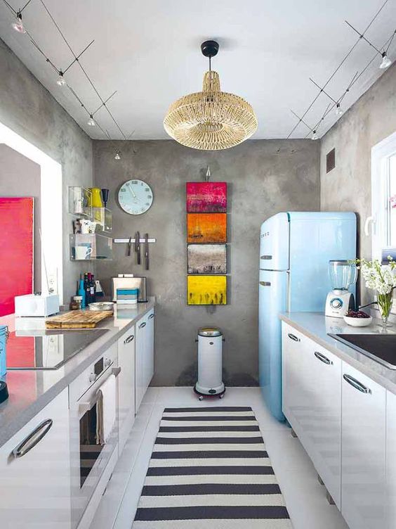 add touches of color with artworks and a bold fridge, for example, Smeg