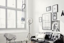 08 a chic black leather sofa is a harmonious part of this Scandinavian space