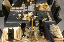 08 a fun black and gold tablescape with stars, stripes and candles is amazing for a New Year’s Eve