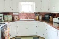 09 a pink tile backsplash, a colorful tile floor and bold dishes over the cabinets