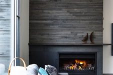 09 a reclaimed wood panel wall to highlight the fireplace